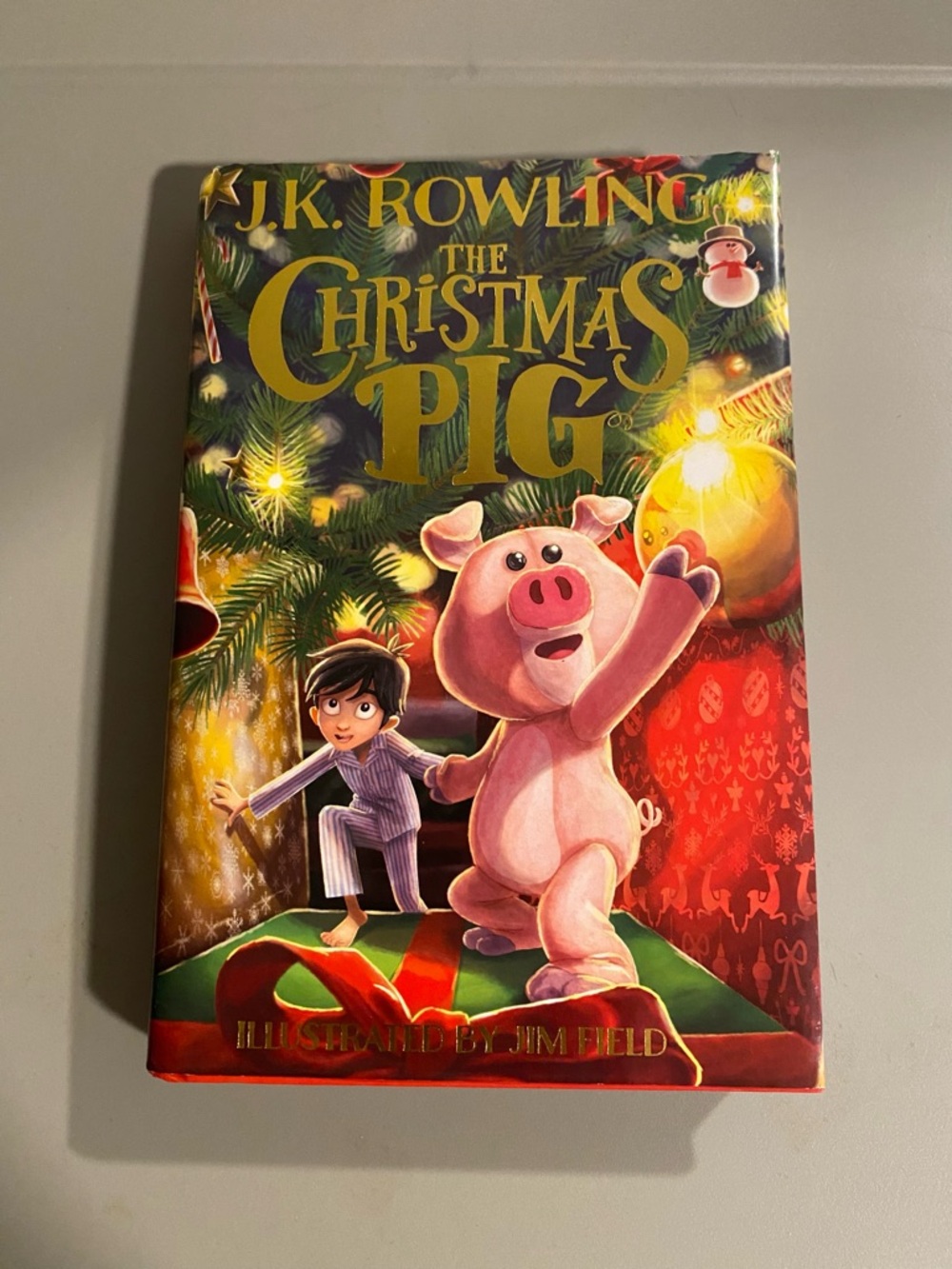 J.K. Rowling "The Christmas Pig" Hardcover - Festive Red & Green Cover